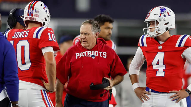 New England Patriots head coach Bill Belichick with quarterback Mac Jones (10) and quarterback Bailey Zappe (4)