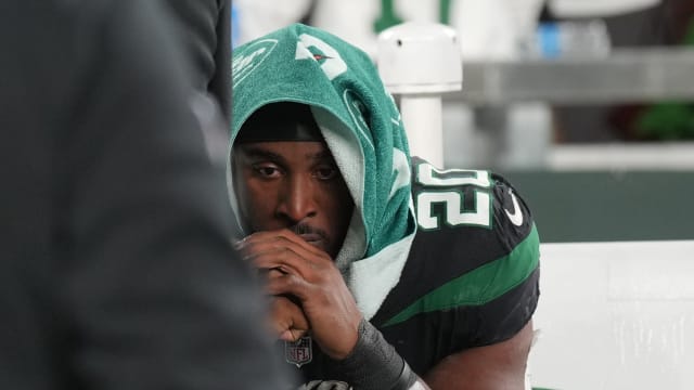 Jets' RB Breece Hall sits on the bench following a loss to the Dolphins