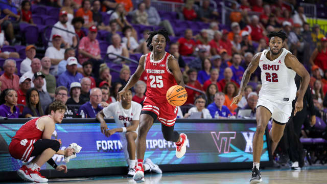 Nov 22, 2023; Fort Myers, FL, USA; Wisconsin Badgers guard John Blackwell (25) dribbles down court against the Southern Methodist Mustangs in the second half during the Fort Myers Tip-Off championship game at Suncoast Credit Union Arena. Mandatory Credit: Nathan Ray Seebeck-USA TODAY Sports