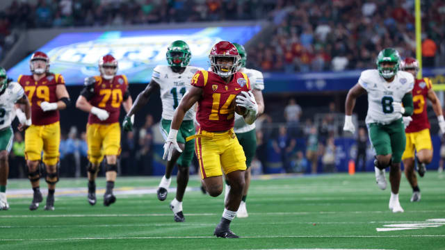 Jan 2, 2023; Arlington, Texas, USA; USC Trojans running back Raleek Brown (14) runs for a touchdown during the first half against the Tulane Green Wave in the 2023 Cotton Bowl at AT&T Stadium. Mandatory Credit: Kevin Jairaj-USA TODAY Sports