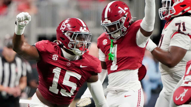 Alabama Crimson Tide linebacker Dallas Turner (15) and defensive back Kool-Aid McKinstry (1) celebrate after a stop on third down to force a Georgia Bulldogs field goal attempt at Mercedes-Benz Stadium.