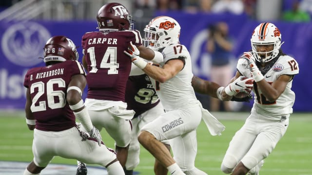 Oklahoma State Cowboys wide receiver Jordan McCray (12) rushes against the Texas A&M Aggies in the fourth quarter at NRG Stadium in 2019.