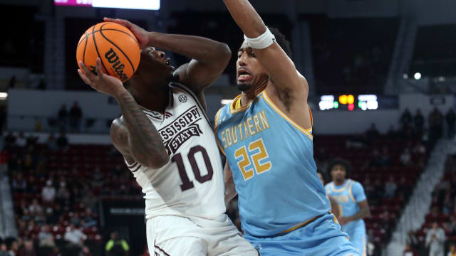 Mississippi State Bulldogs guard Dashawn Davis (10) looks to pass as Southern Jaguars guard Antoine Jacks (2) defends during the second half at Humphrey Coliseum.