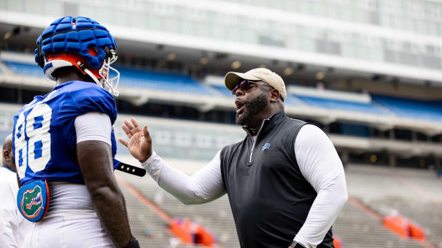 Florida Gators co-defensive coordinator for defensive line Sean Spencer instructs Florida Gators defensive lineman Caleb Banks (88) during fall football practice at Ben Hill Griffin Stadium at the University of Florida in Gainesville, FL on Saturday, August 5, 2023.
