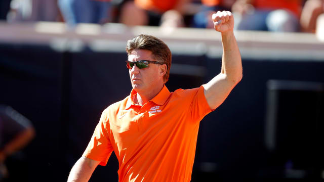 Oklahoma State coach Mike Gundy gestures to the crowd before last year's game against Texas at Boone Pickens Stadium in Stillwater on Oct. 22. Oklahoma State won 41-34. 