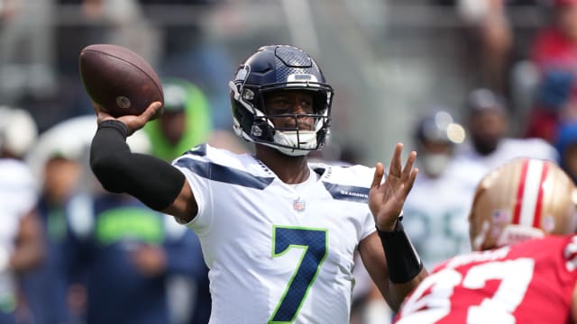 Seattle Seahawks quarterback Geno Smith (7) passes the football against San Francisco 49ers defensive end Nick Bosa (97) during the first quarter at Levi's Stadium.