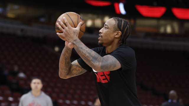 Chicago Bulls forward DeMar DeRozan (11) warms up before a basketball game against the Charlotte Hornets at United Center.