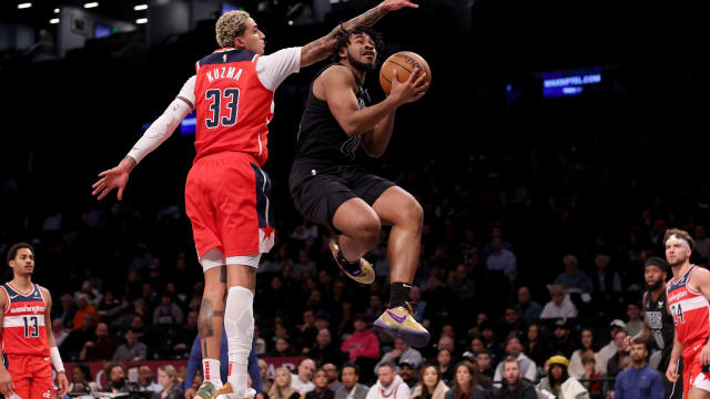 Brooklyn Nets guard Cam Thomas (24) drives to the basket against Washington Wizards forward Kyle Kuzma (33) during the first quarter at Barclays Center.