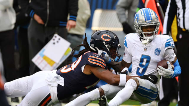 Detroit Lions wide receiver Jameson Williams is tackled after a short gain.