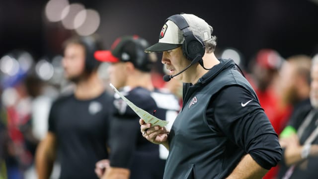 Atlanta Falcons head coach Arthur Smith looks at a play sheet against the Tampa Bay Buccaneers in the first half at Mercedes-Benz Stadium.