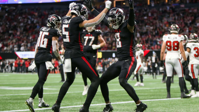 Atlanta Falcons wide receiver Drake London (5) celebrates after a two-point conversion with tight end Kyle Pitts (8) against the Tampa Bay Buccaneers in the second half at Mercedes-Benz Stadium.