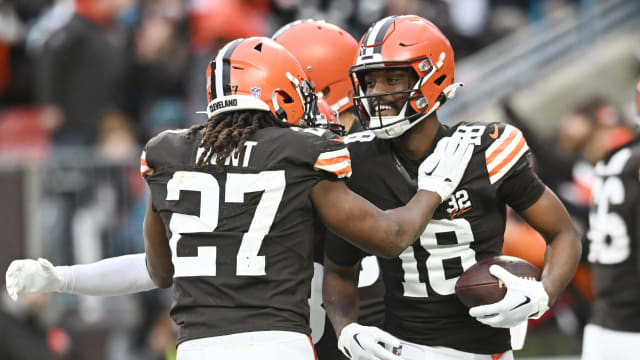 Dec 10, 2023; Cleveland, Ohio, USA; Cleveland Browns running back Kareem Hunt (27) and wide receiver David Bell (18) celebrate after Bell caught a touchdown pass during the second half against the Jacksonville Jaguars at Cleveland Browns Stadium. Mandatory Credit: Ken Blaze-USA TODAY Sports