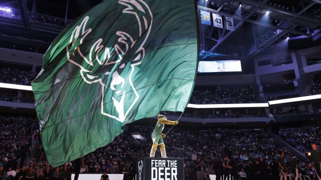  Milwaukee Bucks mascot Bango wave a Milwaukee Bucks flag 