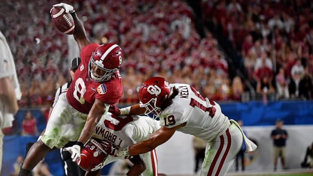 Dec 29, 2018; Miami Gardens, FL, USA; Alabama Crimson Tide running back Josh Jacobs (8) attempts to leap over Oklahoma Sooners cornerback Tre Brown (6) and linebacker Caleb Kelly (19) in the 2018 Orange Bowl college football playoff semifinal game at Hard Rock Stadium. Mandatory Credit: Jasen Vinlove-USA TODAY Sports