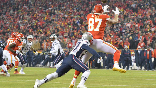 Jan 20, 2019; Kansas City, MO, USA; Kansas City Chiefs tight end Travis Kelce (87) catches a touchdown pass in front of New England Patriots defensive back J.C. Jackson (27) during the second half of the AFC Championship game at Arrowhead Stadium. Mandatory Credit: Denny Medley-USA TODAY Sports  