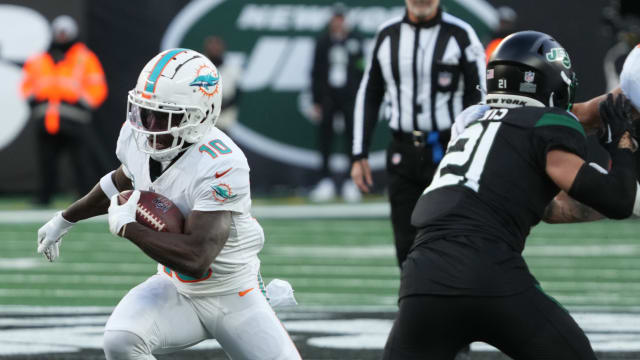 Dolphins' WR Tyreek Hill runs after the catch vs. the Jets