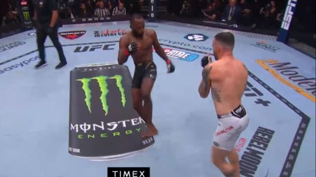 Leon Edwards throws a leg kick during his UFC 296 title fight against Colby Covington.