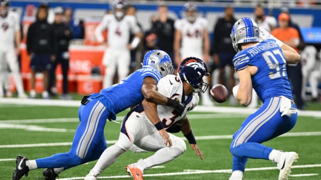 Detroit Lions safety Ifeatu Melifonwu sacks Denver Broncos quarterback Russell Wilson and forces a fumble.