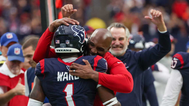 Houston Texans head coach DeMeco Ryans hugs safety Jimmie Ward (1) after he intercepted the ball against the Denver Broncos late in the fourth quarter at NRG Stadium.