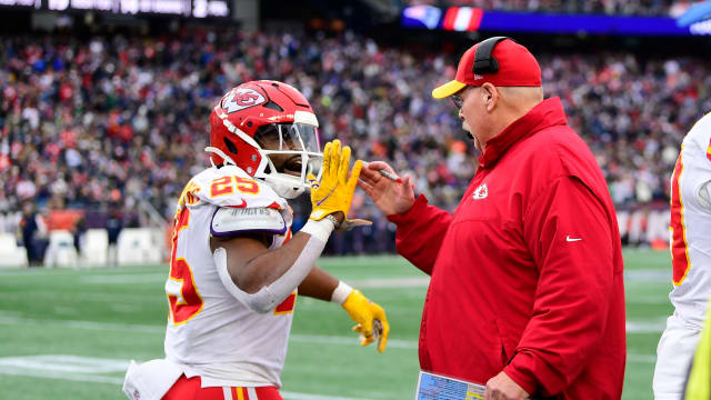 Dec 17, 2023; Foxborough, Massachusetts, USA; Kansas City Chiefs running back Clyde Edwards-Helaire (25) celebrates his touchdown with head coach Andy Reid during the second half against the New England Patriots at Gillette Stadium. Mandatory Credit: Eric Canha-USA TODAY Sports  
