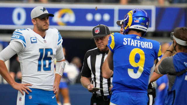 Detroit Lions quarterback Jared Goff talks to Matthew Stafford