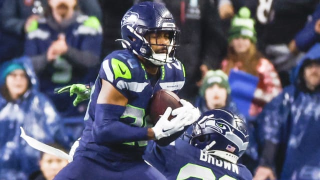 Seattle Seahawks safety Julian Love (20) intercepts a pass against the Philadelphia Eagles during the fourth quarter at Lumen Field.