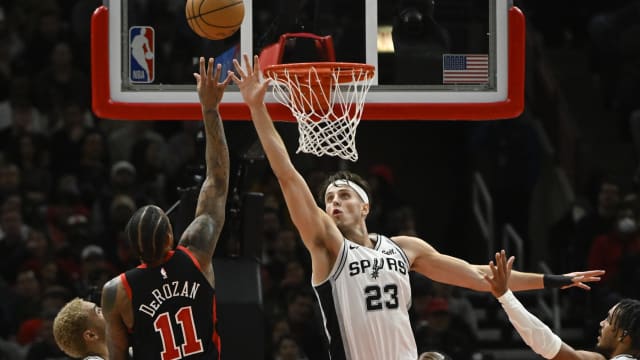 San Antonio Spurs forward Zach Collins (23) defends against Chicago Bulls forward DeMar DeRozan (11) during the second half at the United Cente
