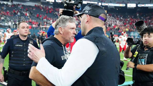 Dec 23, 2023; Las Vagas, NV, USA; Utah Utes head coach Kyle Whittingham greets Northwestern Wildcats head coach David Braun after the Wildcats defeated the Utes 14-7 to win the Las Vegas Bowl at Allegiant Stadium. Mandatory Credit: Stephen R. Sylvanie-USA TODAY Sports 