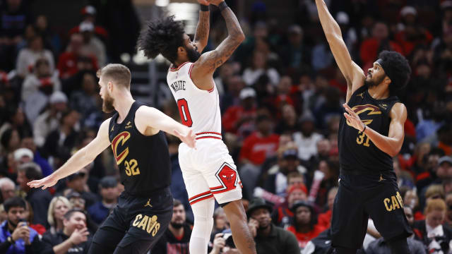 Chicago Bulls guard Coby White (0) shoots against Cleveland Cavaliers center Jarrett Allen (31) during the second half at United Center.