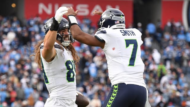Seattle Seahawks tight end Colby Parkinson (84) celebrates with quarterback Geno Smith (7) after scoring the game-winning touchdown during the second half against the Tennessee Titans at Nissan Stadium.