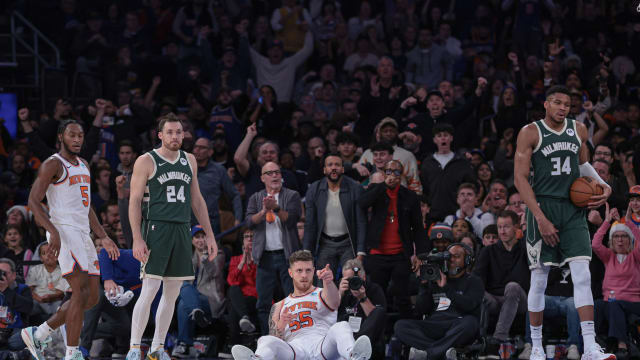  New York Knicks center Isaiah Hartenstein (55) reacts after a basket as Milwaukee Bucks guard Pat Connaughton (24) and forward Giannis Antetokounmpo (34) look up 