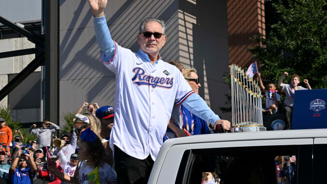 Texas Rangers manager Bruce Bochy waves to fans as he takes part in the club's World Series championship parade on Nov. 3 at Globe Life Field.