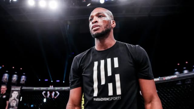 Michael Page stands inside the cage following a Bellator fight.