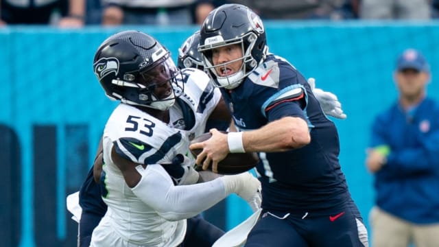 Seattle Seahawks linebacker Boye Mafe (53) tackles Tennessee Titans quarterback Ryan Tannehill (17) late in the fourth quarter during their game at Nissan Stadium in Nashville, Tenn.