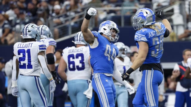 Detroit Lions linebackers Malcolm Rodriguez and Alex Anzalone celebrate against the Dallas Cowboys.