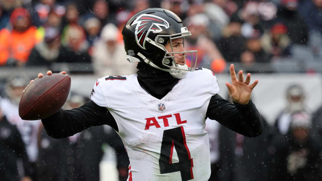 Dec 31, 2023; Chicago, Illinois, USA; Atlanta Falcons quarterback Taylor Heinicke (4) drops back to pass against the Chicago Bears during the first half at Soldier Field.