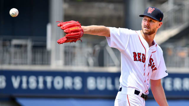 Boston Red Sox ace Chris Sale receives a throw back from the catcher while pitching a simulated inning Thursday at Polar Park.  