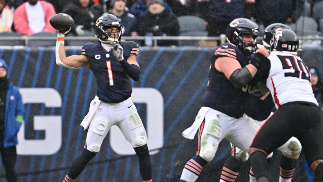 Dec 31, 2023; Chicago, Illinois, USA; Chicago Bears quarterback Justin Fields (1) passes in the first half against the Atlanta Falcons at Soldier Field.