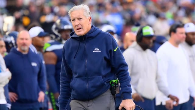 Seattle Seahawks head coach Pete Carroll walks towards a referee during the first half against the Pittsburgh Steelers at Lumen Field.
