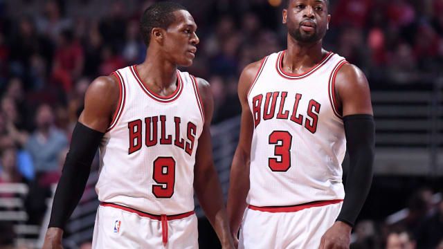 Chicago Bulls guard Rajon Rondo (9) talks with guard Dwyane Wade (3) during the first half against the Washington Wizards at the United Center.