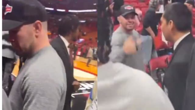 Colby Covington argues with a Jorge Masvidal fan during a Miami Heat NBA game.