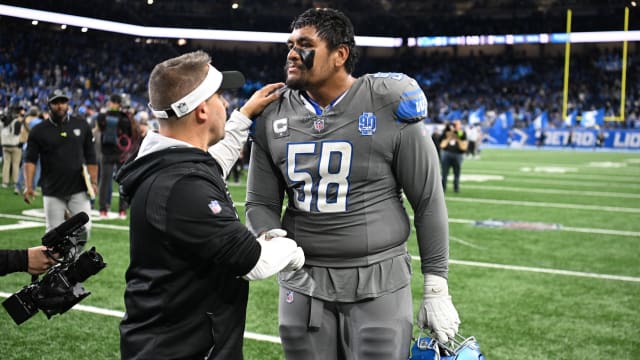 Oct 30, 2023; Detroit, Michigan, USA; Las Vegas Raiders head coach Josh McDaniels congratulates Detroit Lions offensive tackle Penei Sewell (58) after the Lions beat the Raiders in Monday Night Football at Ford Field. 
