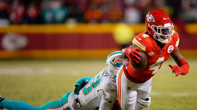 Jan 13, 2024; Kansas City, Missouri, USA; Kansas City Chiefs wide receiver Rashee Rice (4) moves the ball ahead of Miami Dolphins cornerback Ethan Bonner (38) during the first half of the 2024 AFC wild card game at GEHA Field at Arrowhead Stadium. Mandatory Credit: Jay Biggerstaff-USA TODAY Sports  