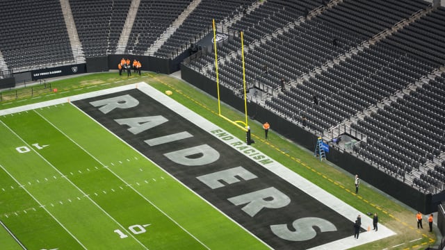 Nov 26, 2023; Paradise, Nevada, USA; The words End Racism and Raiders logo in the end zone at Allegiant Stadium. Mandatory Credit: Kirby Lee-USA TODAY Sports