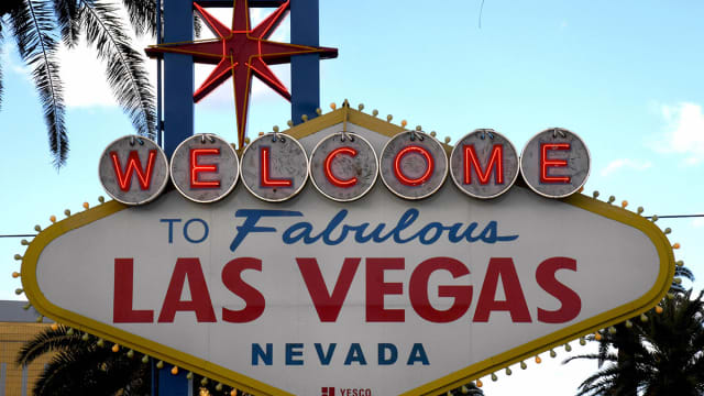 SPORTS ILLUSTRATED * Super Bowl Strip Tease: The NFL and Las Vegas Are Together at Last * Las-vegas-sign-strip