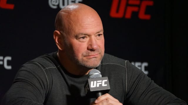 UFC CEO Dana White listens during a media scrum.