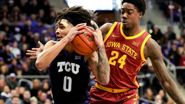 TCU Horned Frogs guard Micah Peavy (0) drives to the basket as Iowa State Cyclones forward Hason Ward (24) defends during the first half at Ed and Rae Schollmaier Arena. 