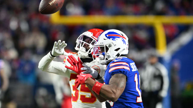 Jan 21, 2024; Orchard Park, New York, USA; Kansas City Chiefs cornerback Jaylen Watson (35) breaks up a pass for Buffalo Bills wide receiver Trent Sherfield (16) in the first half of the 2024 AFC divisional round game at Highmark Stadium. Mandatory Credit: Mark Konezny-USA TODAY Sports  