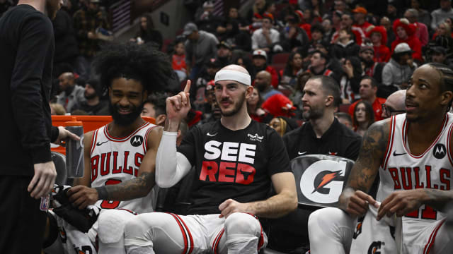 Chicago Bulls guard Coby White (0), guard Alex Caruso (6) and forward DeMar DeRozan (11) laugh on the bench against the Memphis Grizzlies during the second half at the United Center. 