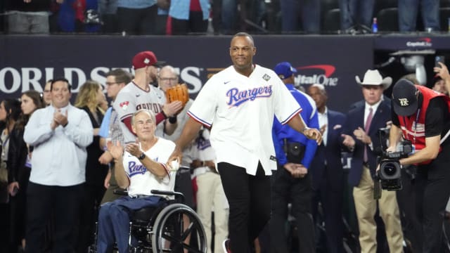 Former Texas Rangers third baseman Adrian Beltre attempts to throw out the ceremonial first pitch before Game 2 of the 2023 World Series against the Arizona Diamondbacks on Oct. 28 at Globe Life Field in Arlington. Beltre was elected into the Baseball Hall of Fame on Tuesday, receiving 95.1% of the vote.